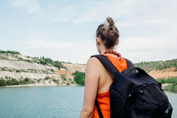 Female traveler coming on the lake