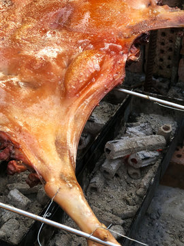 Closeup of fresh and delicious roast suckling pig, baked in a homemade red brick charcoal stove