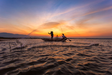 Fishermen in a boat on the lake