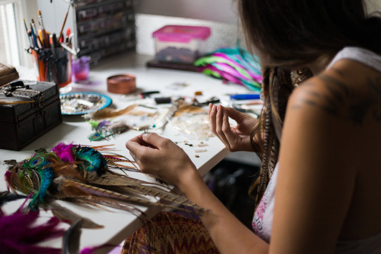 Woman making  handmade earrings