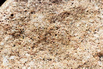 Texture of rocks on the seashore close-up. Natural stone background