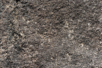 Texture of rocks on the seashore close-up. Natural stone background