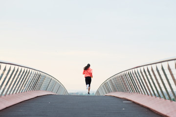 Athlete Jogging On Bridge