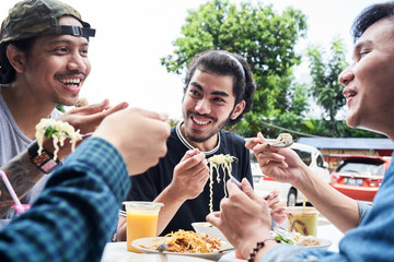 Best friends eating street food and healthy fresh juices in summer.