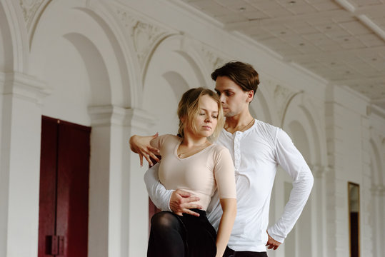 Sensual dancers in motion of performance