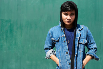 Asian angry young adult looking at camera.