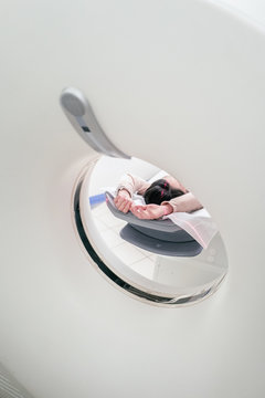 Patient entering a magnetic resonance machinery