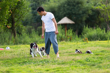 Young asian man with his dog outdoor