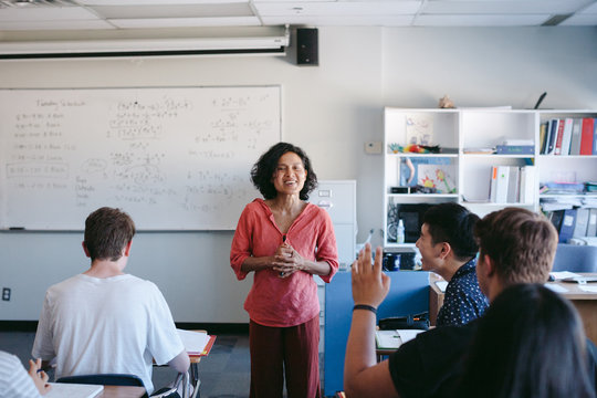 Highschool students and teacher during class