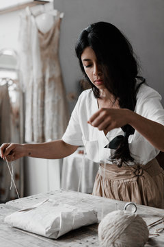 Young business owner packing an order
