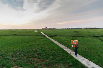 Active Senior Lifestyle Painter on Boardwalk