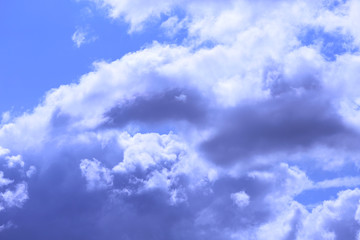 Blue sky texture background with white fluffy clouds. Horizontal, nobody, place for text. The concept of nature and meteorology.