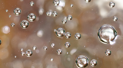 Bubbles of air on the surface of water as an abstract background