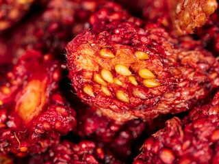 Red dried strawberries as background
