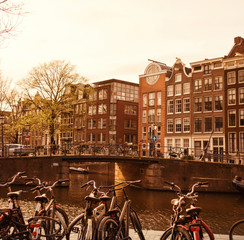 Fototapeta premium Traditional old buildings and canal in Amsterdam, Netherlands