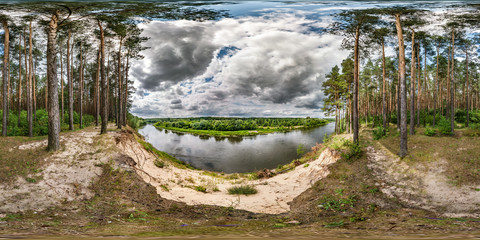 full seamless spherical hdri panorama 360 degrees angle view on high bank of wide river neman near pinery forest in windy day with beautiful clouds in equirectangular projection, ready VR AR content