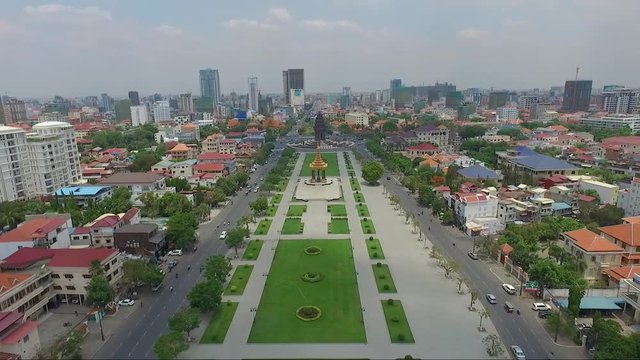 Panoramic view of Independence park in the middle of King Sihanouk boulevard, with King father Norodom monument and Independence monument, Phnom Penh, Cambodia