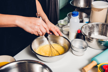 Woman beat dough mixer manual by hands