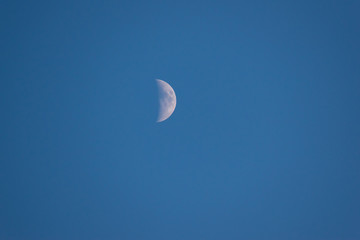 Moon on the blue sky.