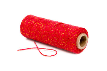 spool of twine red with gold shimmer