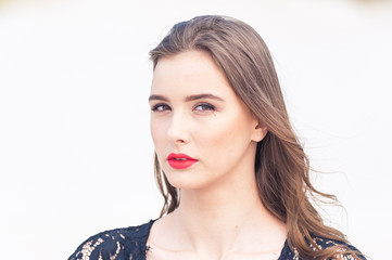 Beautiful young woman posing on the desert sand dune