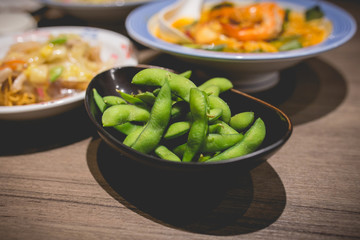 Edamame or soybeans are commonly served at Japanese Restaurants