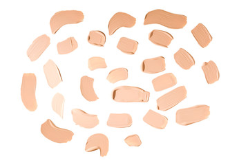 Liquid foundation swatch isolated on white background. Close Up of makeup cream sample.