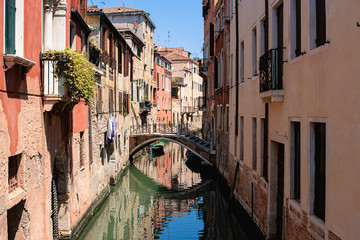 Beautiful venetian street in summer day, Italy.