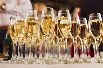 Close up the glasses of champagne on the table