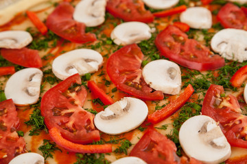 Raw pizza fragment with tomatoes and mushrooms, macro
