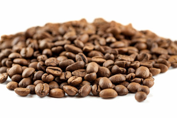 Roasted coffee beans on white background, close-up
