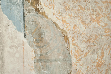 The texture of an old concrete wall with drawings and patterns.