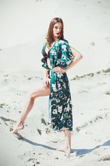 Portrait of beautiful woman dressed in green swimwear