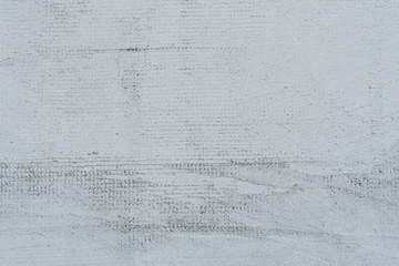 Texture of a concrete wall with cracks and scratches which can be used as a background