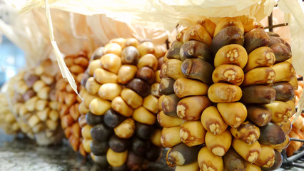 Cute dried corns on table for home decoration. Closeup dried food with leaves image.