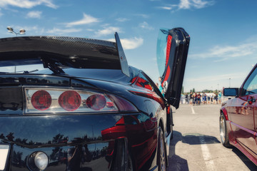 Serial cars with tuning and improved engines at open air exhibition