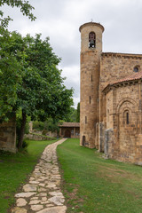 Fototapeta na wymiar Vertical view with path of the Collegiate Church of San Martin de Elines of the twelfth century in Cantabria, Spain, Europe