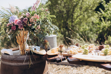 Boho wedding table with eco decor for guests.