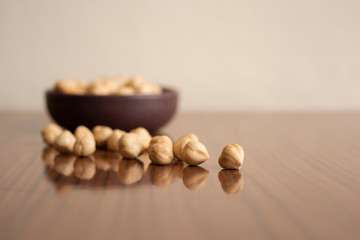 Shelled hazelnuts on a wooden chopping board