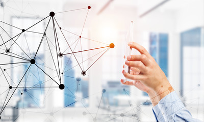 Business and technology concept with networking grid and man using device