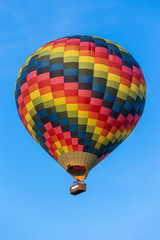 Fototapeta premium A colorful hot air balloon in the sky.