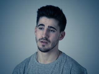 Human expressions, emotions. Young attractive man with sad face, looking depressed and unhappy
