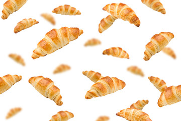 Falling croissant, isolated on white background, selective focus