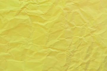 Obraz na płótnie Canvas crumpled yellow paper background or texture