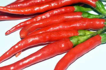 close up fresh red chilies, spicy isolated white background