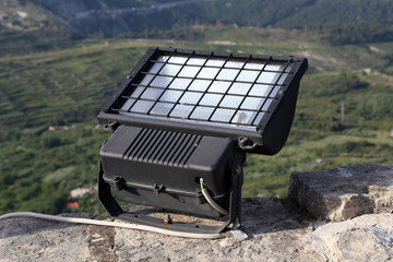Spotlight to illuminate the wall of the old fortress