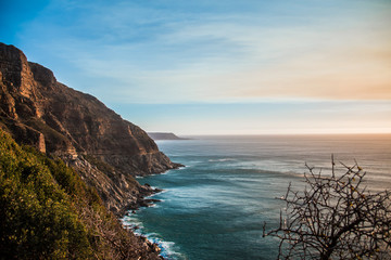 Chapman's Peak Drive Through the Mountains in Cape Town at Sunset Next to the Sea with Crashing Waves in South Africa