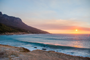Chapman's Peak Drive Through the Mountains in Cape Town at Sunset Next to the Sea with Crashing Waves in South Africa