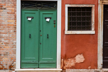 Old beautiful door in the Venetian style