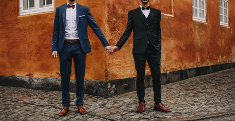 Gay couple walking around the city.